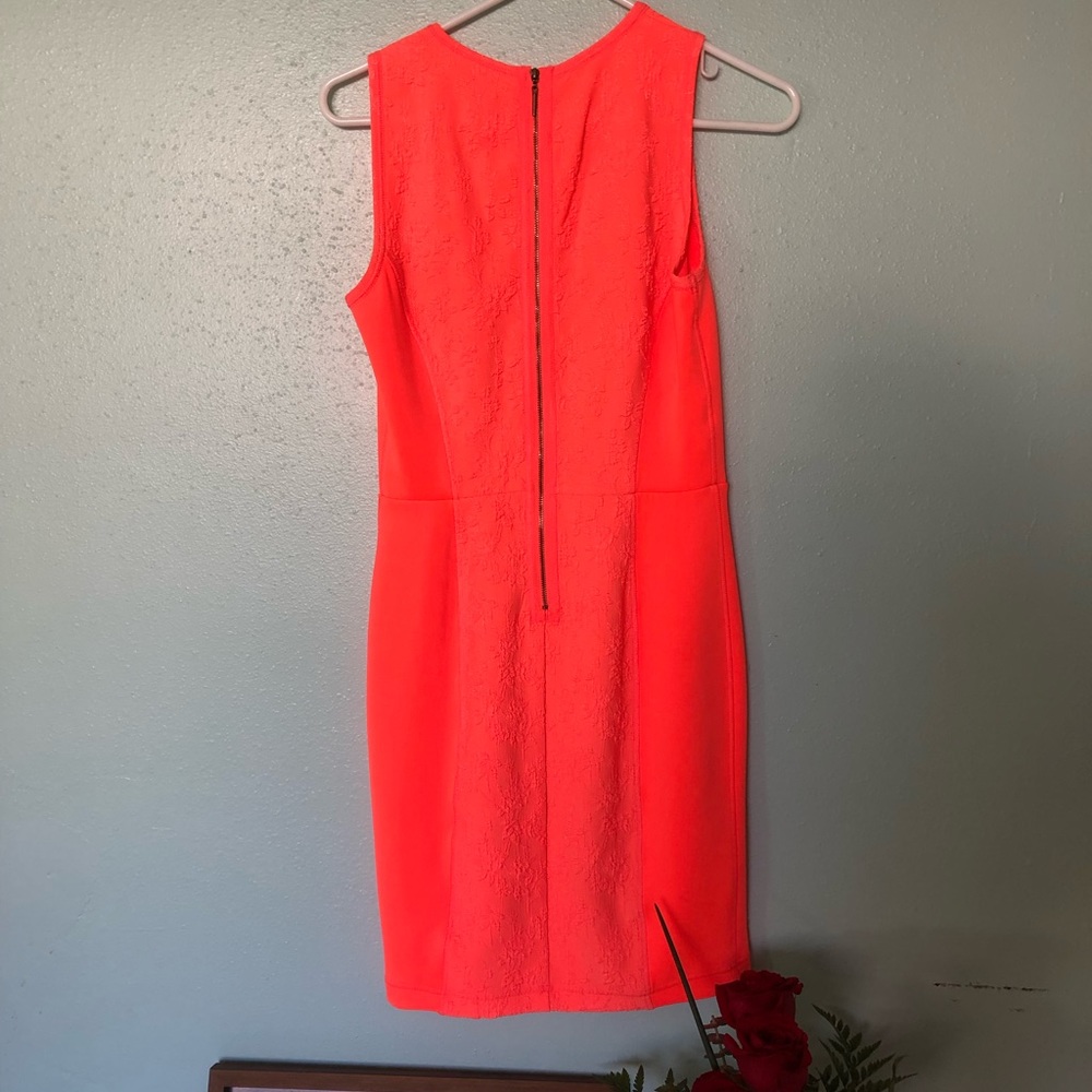 Cute fluorescent orange dress! Size 4, 3/4 zipper on the back.